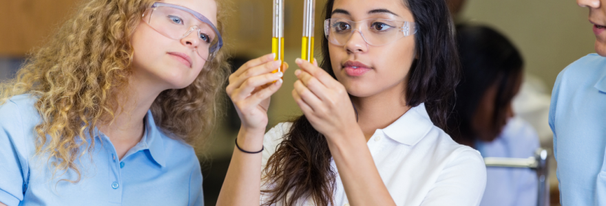 Three high school students in science class