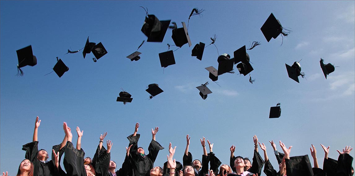Mortar boards thrown in air