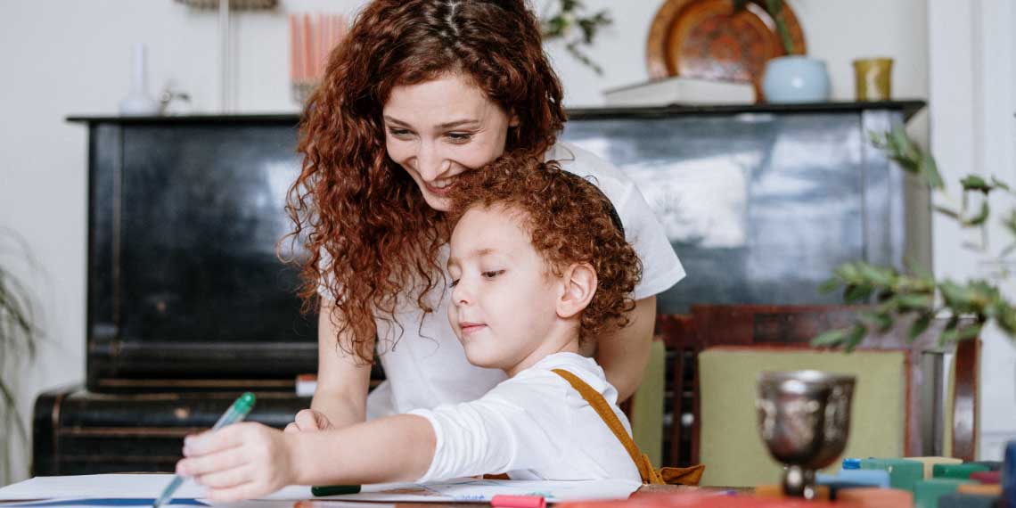 young Jewish mother with her young son with kippah